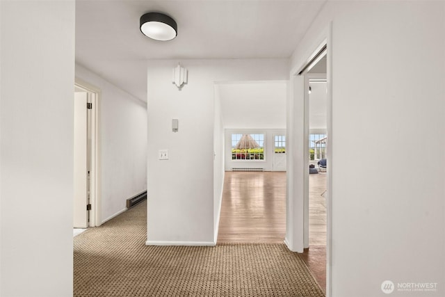 261 SE Adams Ave, Chehalis, WA 98532 - corridor featuring baseboard heating and carpet flooring