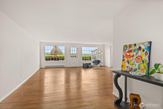 261 SE Adams Ave, Chehalis, WA 98532 - entrance foyer featuring baseboard heating, wood finished floors, and baseboards