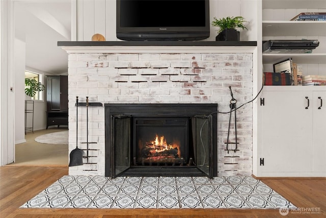 261 SE Adams Ave, Chehalis, WA 98532 - detailed view of a brick fireplace and wood finished floors
