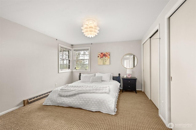 261 SE Adams Ave, Chehalis, WA 98532 - bedroom featuring baseboard heating, light carpet, a closet, and baseboards