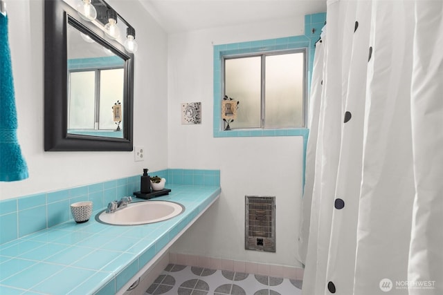 261 SE Adams Ave, Chehalis, WA 98532 - full bathroom with heating unit, vanity, and tile patterned flooring