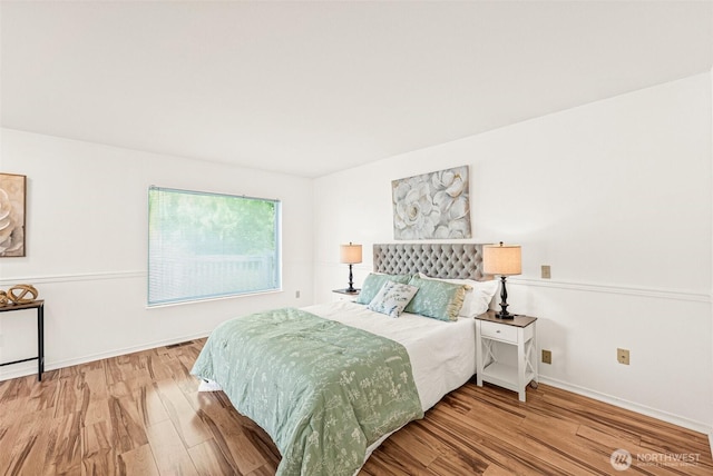 8471 E Caraway Rd, Port Orchard, WA 98366 - bedroom featuring wood finished floors and baseboards