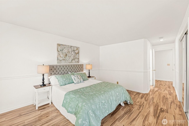 8471 E Caraway Rd, Port Orchard, WA 98366 - bedroom featuring wood finished floors and baseboards