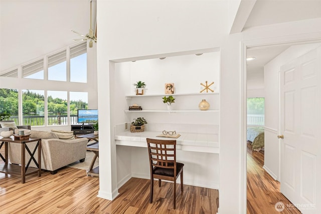 8471 E Caraway Rd, Port Orchard, WA 98366 - bar featuring wood finished floors, a high ceiling, and ceiling fan