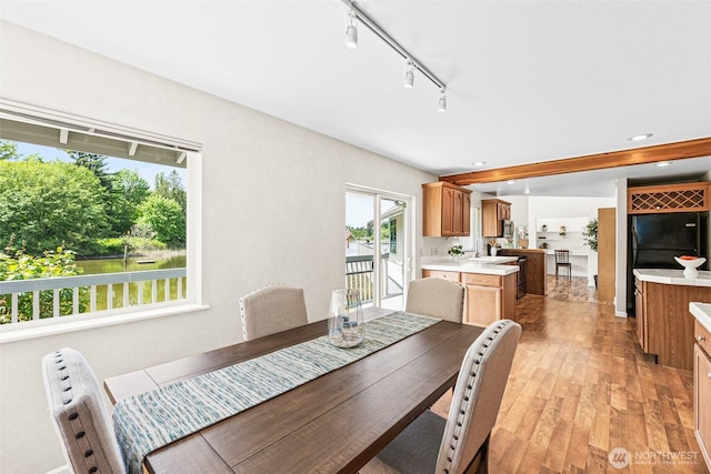 8471 E Caraway Rd, Port Orchard, WA 98366 - dining area with light wood-style floors, rail lighting, and recessed lighting