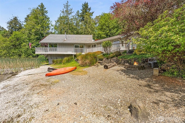 8471 E Caraway Rd, Port Orchard, WA 98366 - back of house featuring a fire pit and a wooden deck