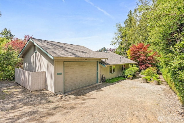 8471 E Caraway Rd, Port Orchard, WA 98366 - view of front of property with an attached garage, roof with shingles, and driveway