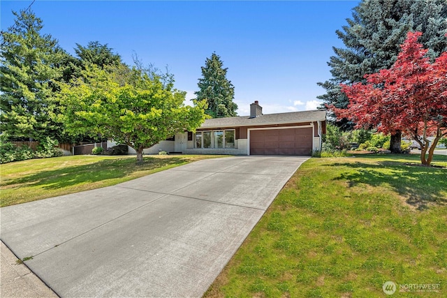 1011 Idaho St, Wenatchee, WA 98801 - view of front of property with a garage, driveway, and a chimney