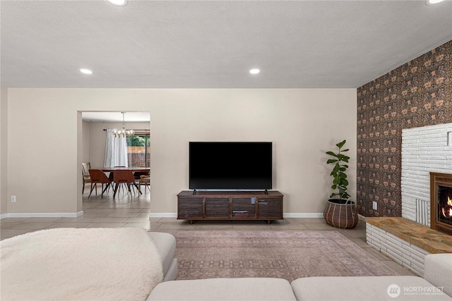 1011 Idaho St, Wenatchee, WA 98801 - living room with baseboards, tile patterned flooring, a chandelier, a fireplace, and recessed lighting