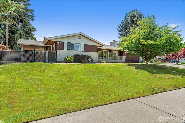 1011 Idaho St, Wenatchee, WA 98801 - view of front facade featuring a garage, brick siding, a chimney, driveway, and a gate
