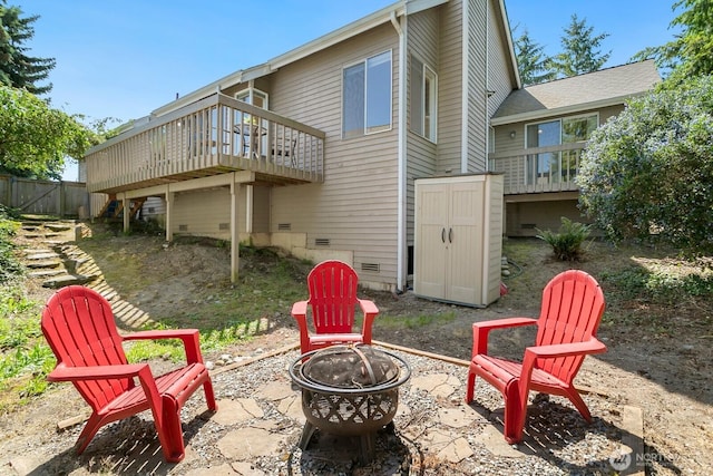 4754 SW 314th Pl, Federal Way, WA 98023 - back of property featuring an outdoor fire pit, a deck, and a storage unit