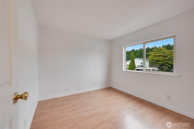 19920 67th Ave NE Unit 40, Arlington, WA 98223 - empty room featuring wood finished floors and baseboards