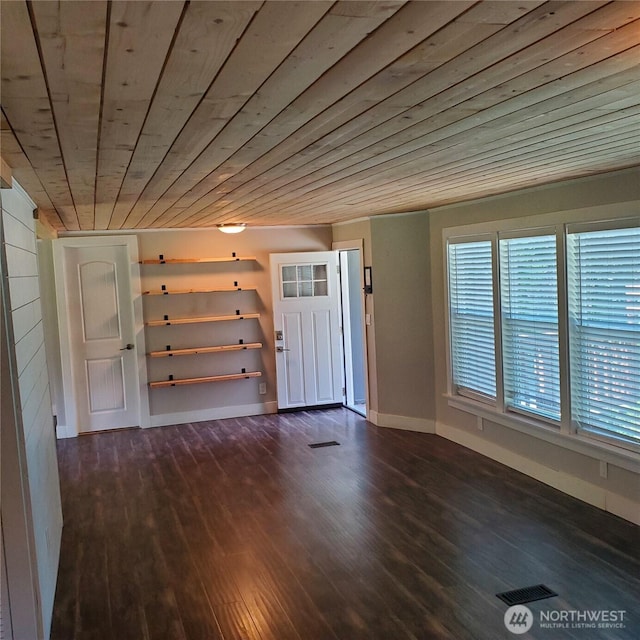 14518 Kapowsin Hwy E, Graham, WA 98338 - foyer with wooden ceiling, baseboards, and dark wood finished floors