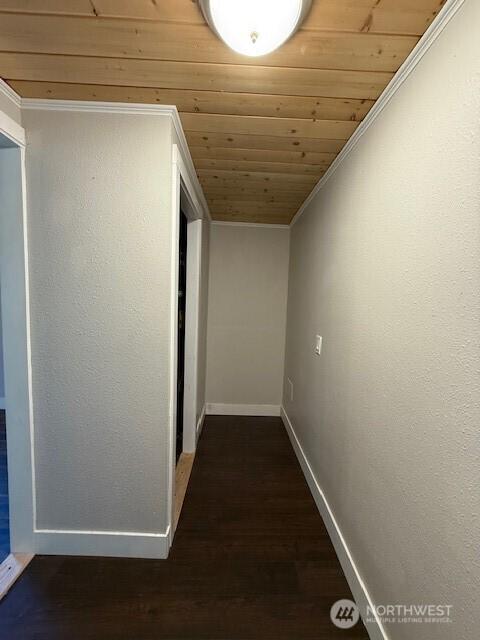 14518 Kapowsin Hwy E, Graham, WA 98338 - hall with wood ceiling, baseboards, dark wood-style floors, and ornamental molding