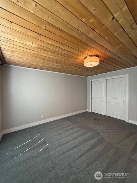 14518 Kapowsin Hwy E, Graham, WA 98338 - additional living space featuring wooden ceiling, dark carpet, and baseboards