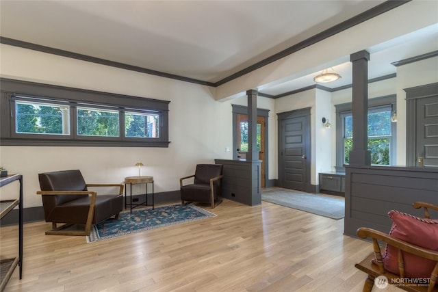 366 S Palouse St, Walla Walla, WA 99362 - living area with decorative columns, crown molding, light wood-style floors, and baseboards