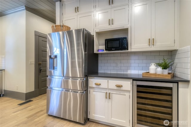 366 S Palouse St, Walla Walla, WA 99362 - kitchen featuring beverage cooler, stainless steel fridge, black microwave, dark countertops, and backsplash