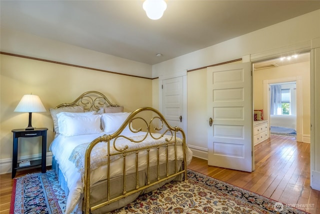 366 S Palouse St, Walla Walla, WA 99362 - bedroom with wood-type flooring, baseboards, and a closet