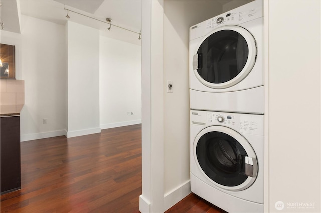 737 Olive Way Unit 2704, Seattle, WA 98101 - laundry room featuring stacked washer / drying machine and dark wood-type flooring
