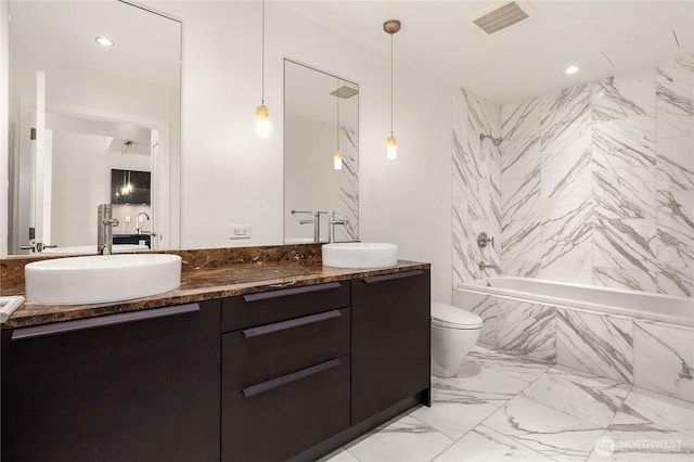 737 Olive Way Unit 2704, Seattle, WA 98101 - full bathroom featuring double vanity, a combined bath / shower with marble appearance, marble finish floors, and recessed lighting