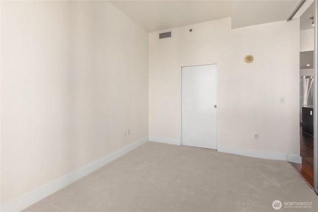 737 Olive Way Unit 2704, Seattle, WA 98101 - unfurnished bedroom featuring light carpet and baseboards
