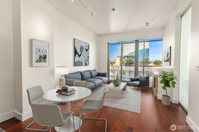 737 Olive Way Unit 2704, Seattle, WA 98101 - living room with dark wood finished floors and track lighting