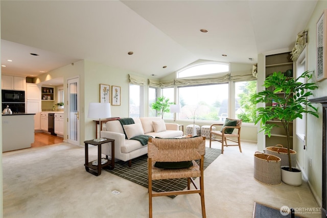 2650 W Newton St, Seattle, WA 98199 - living room featuring light colored carpet and vaulted ceiling