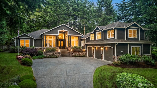 5004 Bridlepath Dr NW, Gig Harbor, WA 98332 - view of front of property featuring concrete driveway, stone siding, a garage, a front yard, and a porch