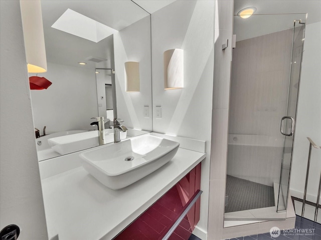 13893 NE 69th St Unit 689, Redmond, WA 98052 - bathroom with a stall shower, vanity, and tile patterned floors