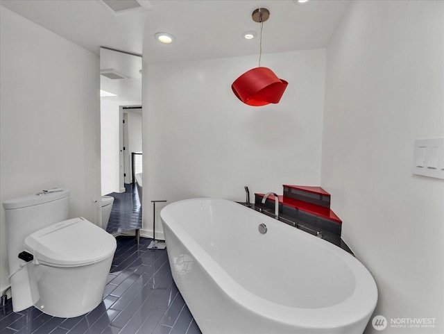 13893 NE 69th St Unit 689, Redmond, WA 98052 - full bathroom with a soaking tub, recessed lighting, and tile patterned floors