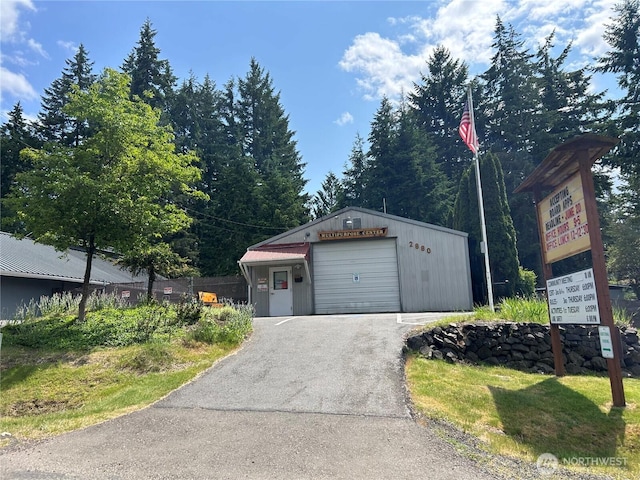 350 E Lakeshore Dr E, Shelton, WA 98584 - view of front of property featuring a detached garage, driveway, and an outdoor structure