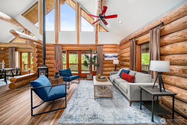 3105 Tamarack Pl, Wenatchee, WA 98801 - living area featuring rustic walls, high vaulted ceiling, ceiling fan, healthy amount of natural light, and wood finished floors
