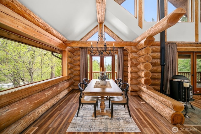 3105 Tamarack Pl, Wenatchee, WA 98801 - dining room featuring log walls, a chandelier, wood finished floors, high vaulted ceiling, and beam ceiling
