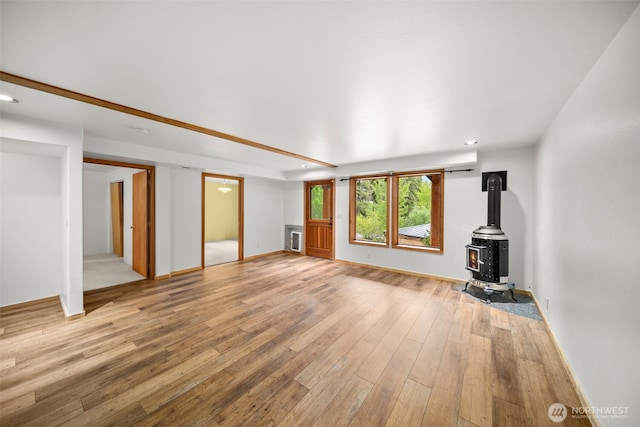3105 Tamarack Pl, Wenatchee, WA 98801 - unfurnished living room with a wood stove, light wood-type flooring, recessed lighting, and baseboards