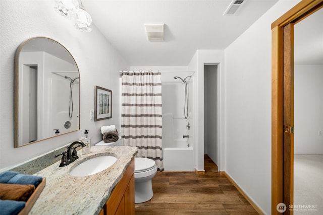 3105 Tamarack Pl, Wenatchee, WA 98801 - bathroom featuring vanity, wood finished floors, toilet, and shower / bath combo