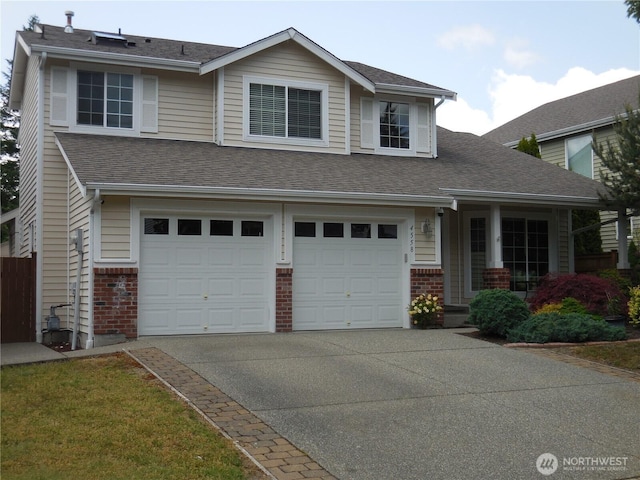 4558 SE Bakken Ct, Port Orchard, WA 98366 - view of front of property featuring an attached garage, brick siding, driveway, a shingled roof, and covered porch