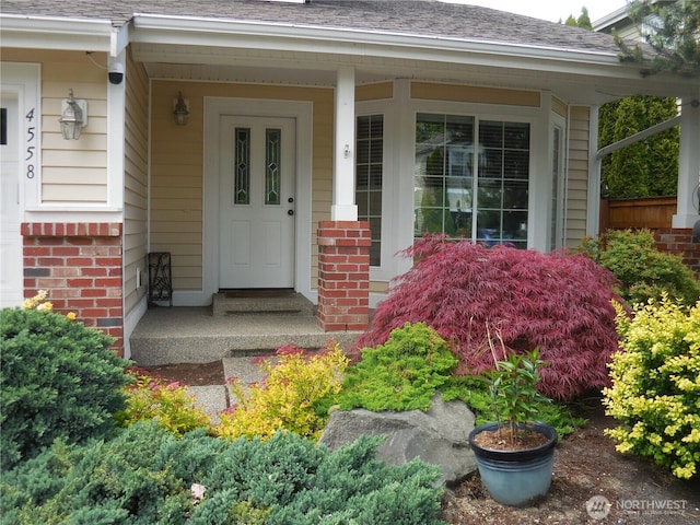 4558 SE Bakken Ct, Port Orchard, WA 98366 - doorway to property with brick siding and a shingled roof