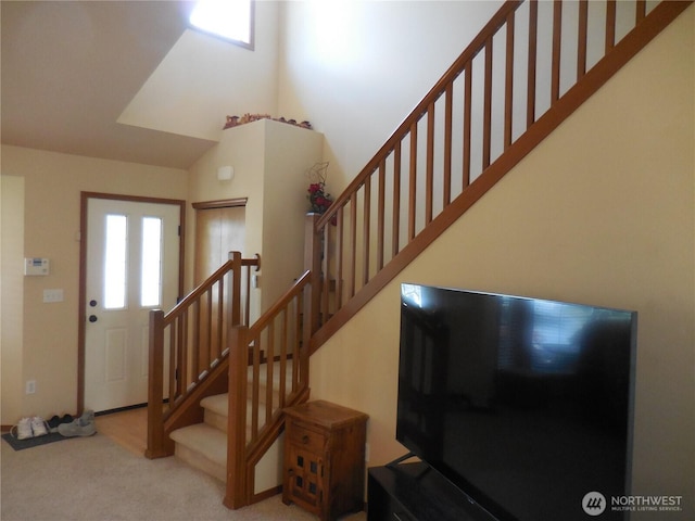 4558 SE Bakken Ct, Port Orchard, WA 98366 - foyer featuring a towering ceiling, carpet floors, and stairs