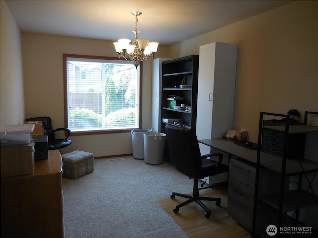 4558 SE Bakken Ct, Port Orchard, WA 98366 - home office with a chandelier, light colored carpet, and baseboards