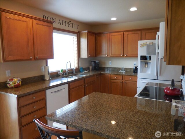 4558 SE Bakken Ct, Port Orchard, WA 98366 - kitchen with a sink, brown cabinetry, range, dishwasher, and recessed lighting