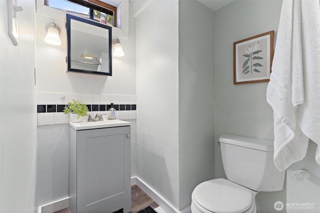 9520 2nd Ave NW, Seattle, WA 98117 - bathroom featuring toilet, vanity, and wood finished floors