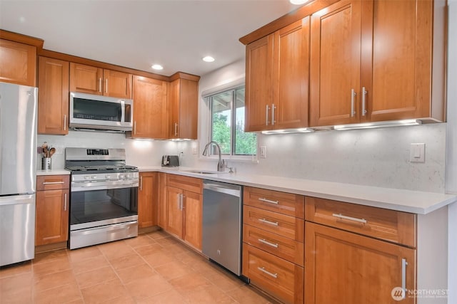 35432 18th Ave SW, Federal Way, WA 98023 - kitchen with stainless steel appliances, a sink, light countertops, brown cabinetry, and recessed lighting