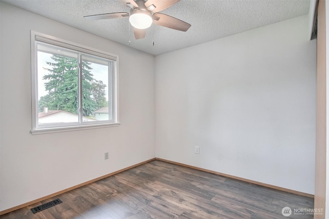 35432 18th Ave SW, Federal Way, WA 98023 - spare room with wood finished floors, a textured ceiling, ceiling fan, and baseboards