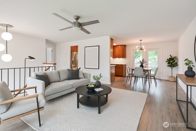 35432 18th Ave SW, Federal Way, WA 98023 - living room featuring ceiling fan, light wood-type flooring, and a chandelier