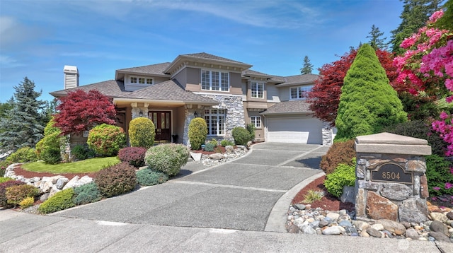 8504 146th Pl SE, Newcastle, WA 98059 - prairie-style home featuring stone siding, asphalt driveway, a chimney, and a garage