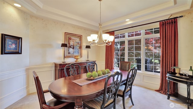 8504 146th Pl SE, Newcastle, WA 98059 - dining room with a chandelier, crown molding, light carpet, a tray ceiling, and a decorative wall