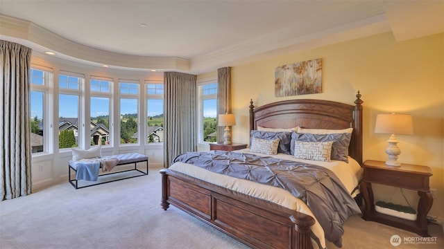 8504 146th Pl SE, Newcastle, WA 98059 - carpeted bedroom featuring multiple windows, a tray ceiling, recessed lighting, and ornamental molding