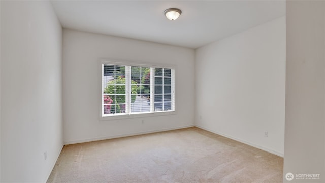 8504 146th Pl SE, Newcastle, WA 98059 - unfurnished room with light carpet and baseboards