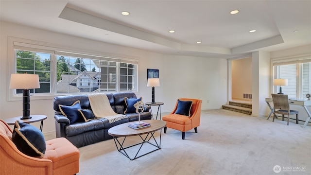 8504 146th Pl SE, Newcastle, WA 98059 - living room with a tray ceiling, light carpet, recessed lighting, and baseboards