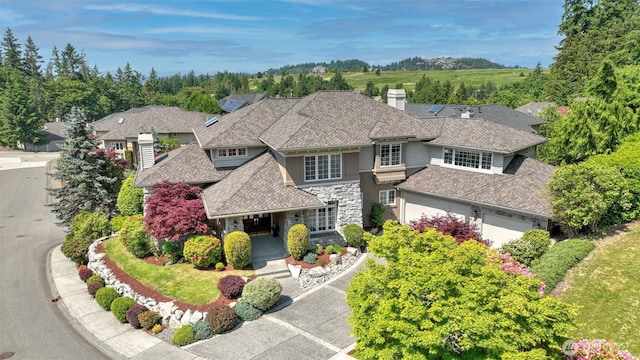 8504 146th Pl SE, Newcastle, WA 98059 - view of front of property with stone siding, a chimney, and roof with shingles
